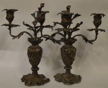 An impressive pair of plated candelabra heavily