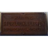 A cast iron sign, "Warning, Stop, Look and Listen