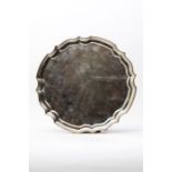 A heavy 12 inch salver with engraved decoration an