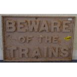 A cast iron sign, "Beware of the Trains". Approx.