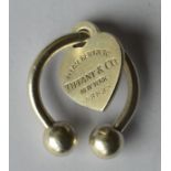 An unusual Tiffany heart shaped pendant with ball
