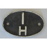 A British Railways cast iron shed code plate."1H"