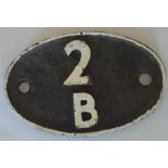 A British Railways cast iron shed code plate."2B",