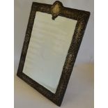 An impressive large easel back mirror with scroll