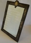 An impressive large easel back mirror with scroll
