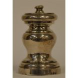 A silver pepper grinder of turned form. Birmingham