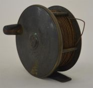 A brass mounted Antique fishing reel. Est. £40 - £