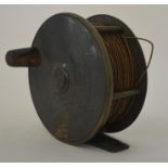 A brass mounted Antique fishing reel. Est. £40 - £