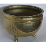 A good brass jardiniere decorated with dragons and