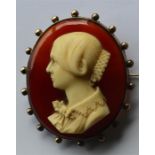 A good large oval cameo of a lady's head carved in ivory in gold frame. Approx. 8 cms high. Est. £