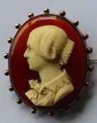 A good large oval cameo of a lady's head carved in ivory in gold frame. Approx. 8 cms high. Est. £