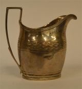 A good Georgian silver bright cut cream jug with r