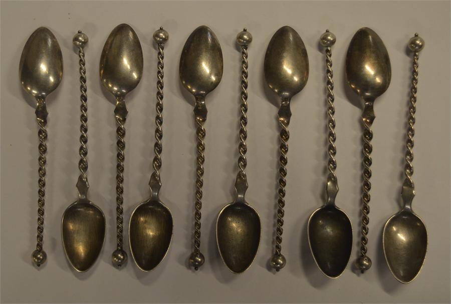 A set of ten Continental ice cream spoons with twi