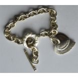 A heavy Tiffany bracelet with heart shaped pendant