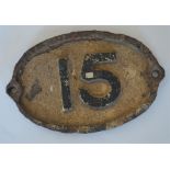 An oval cast iron bridge plate. "15". Approx. 27 c