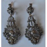 A good pair of Antique old cut earrings with scrol