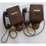 Two signal box telephones, each with oak bell boxe
