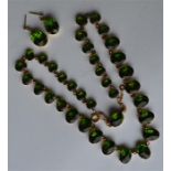 An attractive green stone graduated necklace and m