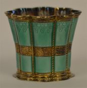 An attractive enamelled vase with gilt interior in