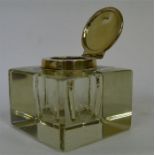 A glass and silver mounted hinged top inkwell. Bir