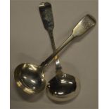 A pair of fiddle pattern sauce ladles with initial
