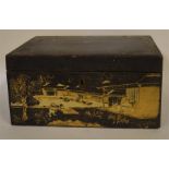 A lacquer tea caddy. Est. £30 - £50.