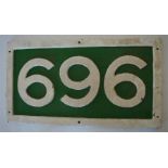 A cast iron number plate, "969" or "696". Approx.