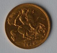 A 1910 half sovereign. Est. £80 - £100.