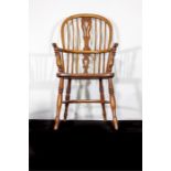 A good oak bow back kitchen chair on turned suppor