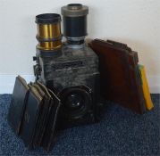 A collection of brass mounted lenses and camera. B