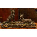 A large marble mounted figure of two Alsatians in