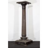 A good ebony column with brass mounts with fluted