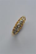 A good diamond five stone ring in 18 carat gold se