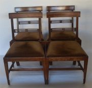 A set of four Georgian mahogany dining chairs on t