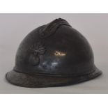 A French artillery helmet mounted with a grenade.