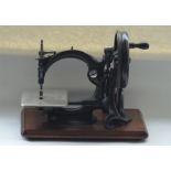 A good cased sewing machine. Est. £30 - £50.
