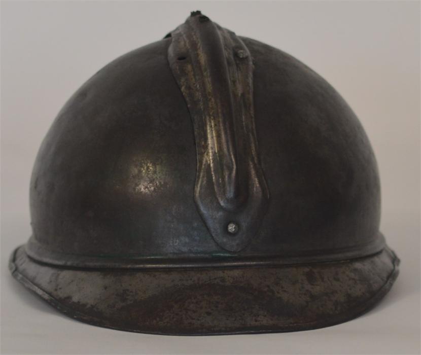 A French artillery helmet mounted with a grenade. - Image 2 of 4