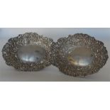 A pair of attractive embossed sweet dishes heavily