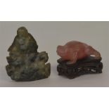 A rose quartz figure of a toad on hardwood base to