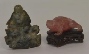 A rose quartz figure of a toad on hardwood base to