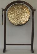 A good oak framed large dinner gong with stretcher