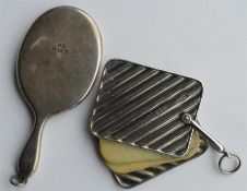 A small handbag mirror together with a fluted aide