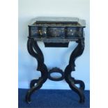 An attractive papier mache sewing box on stand wit