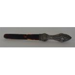 A small tortoiseshell mounted and embossed handle