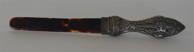 A small tortoiseshell mounted and embossed handle