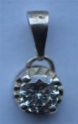 A good diamond small single stone pendant in claw