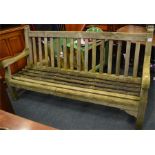 A large slated garden bench. Est. £40 - £60.