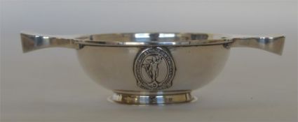 A small two handled quaich on pedestal base with o