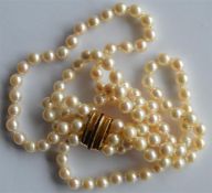 An unusual MOP necklace with high carat gold tasse