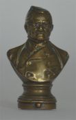 An unusual brass vesta in the form of a bust on pe